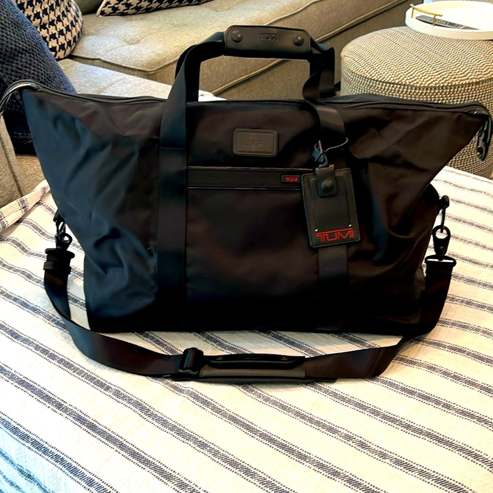 TUMI - weekender, carry-on duffel bag. 22” long, 16”tall, 10” width